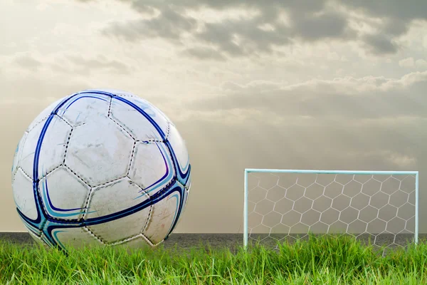 Goalpost net detail with green grass blur in background sports c — Stock Photo, Image