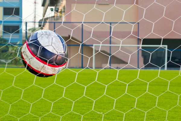 Goalpost net detail with green grass blur in background sports c — Stock Photo, Image