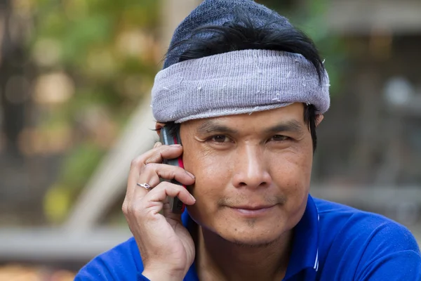 Portrait of mature man talking on phone — Stock Photo, Image