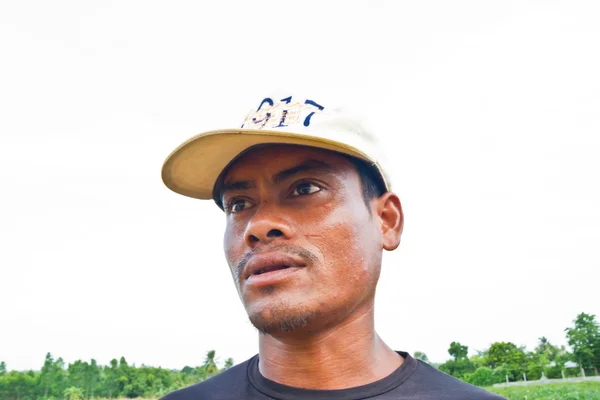 Homem jardinagem na fazenda sorrindo — Fotografia de Stock