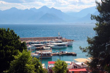 Antalya, Turkey - July 1, 2022: Historical yacht marina and port in Kaleici Old Town of Antalya.