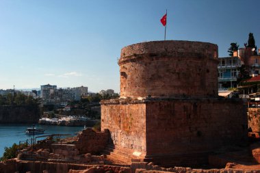 Antalya, Turkey - July 18, 2022: Historical Hidirlik Tower in Kaleici, the Old Town of Antalya