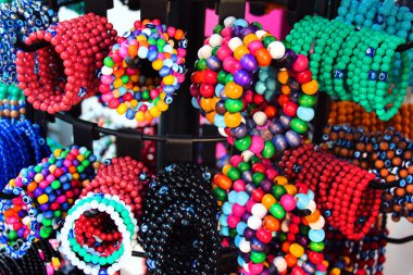 Hand bracelets and souvenirs on display at a street market in Antalya, Turkey