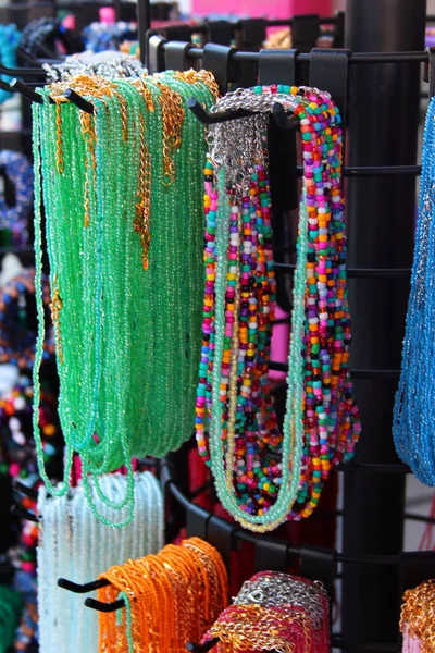 Necklaces, beads and souvenirs on display at a street market in Antalya, Turkey