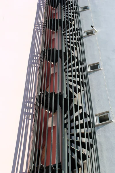 Spiral fire escape ladders and staircases outside a high-rise residential building in Antalya, Turkey