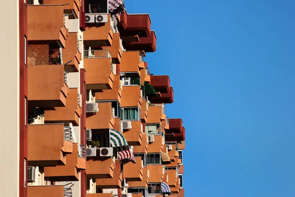 Brown balconies with sunshades on a residential building in Antalya, Turkey