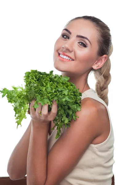 F mujer joven feliz con manojo de hierbas (ensalada) en las manos en blanco — Foto de Stock