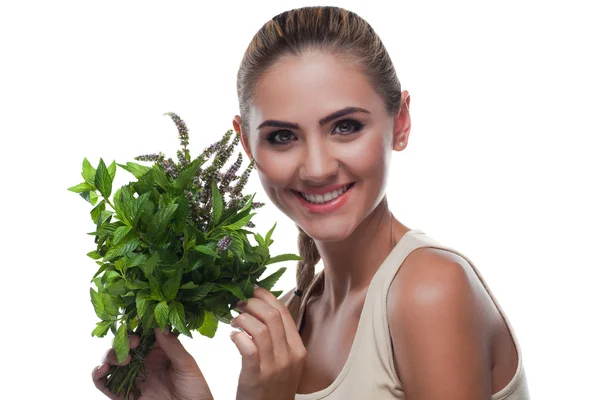 Happy young woman with a bundle of fresh mint. Concept vegetaria — Stock Photo, Image