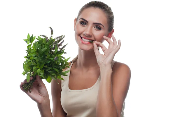 Happy young woman with a bundle of fresh mint. Concept vegetaria — Stock Photo, Image