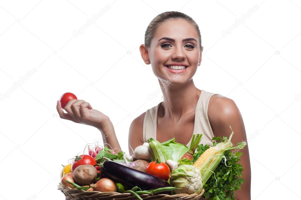 Woman holding basket with vegetable. Concept vegetarian dieting