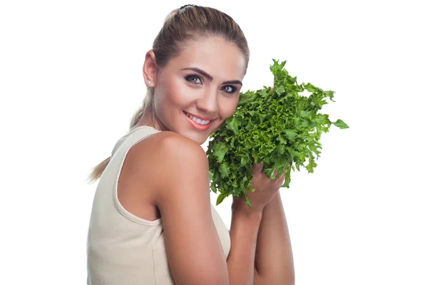 F mujer joven feliz con manojo de hierbas (ensalada) en las manos en blanco — Foto de Stock