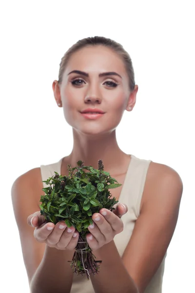 Happy young woman with a bundle of fresh mint. Concept vegetaria — Stock Photo, Image