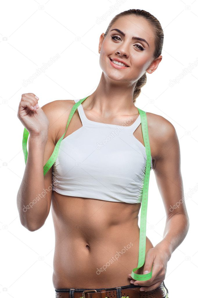 Woman in perfect shape with green measure doing yoga poses. C