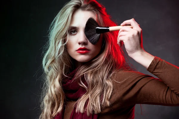 Portrait of beautiful woman with makeup brushes — Stock Photo, Image