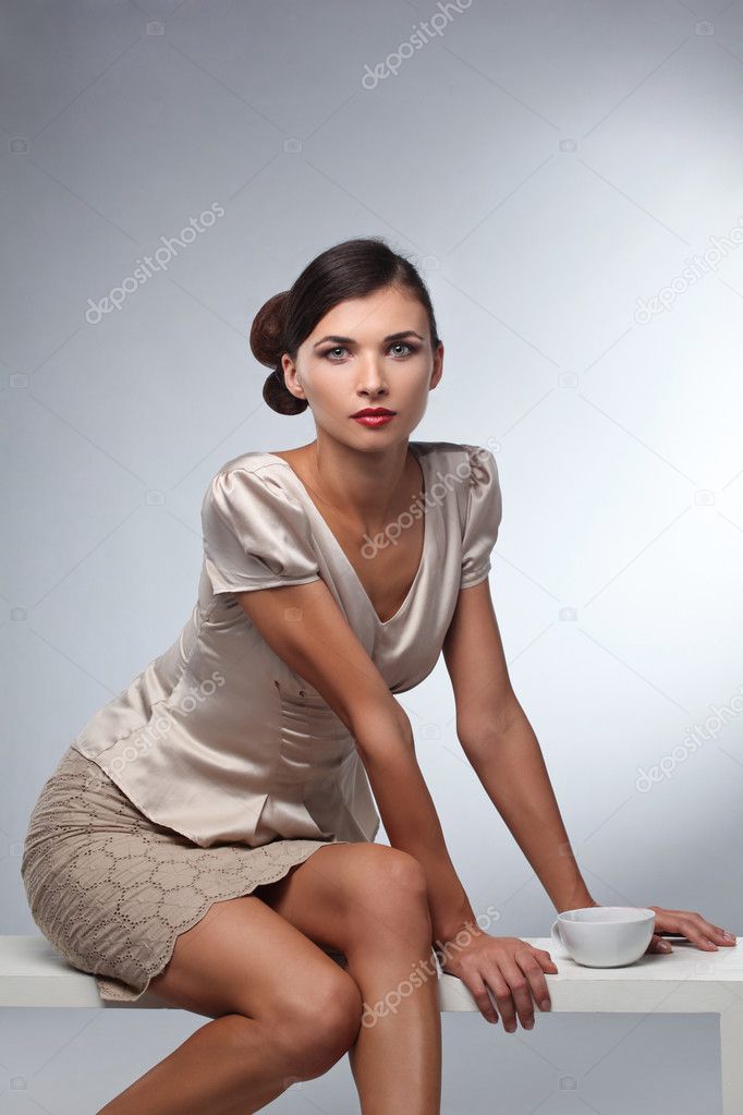 Fashion studio shot of beautiful woman with a luxurious and heal
