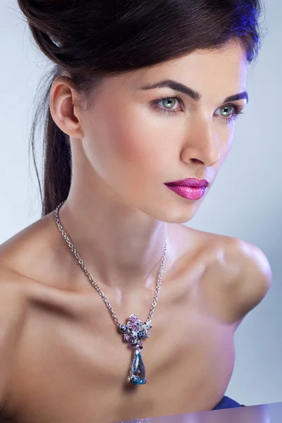 Beautiful fashion model posing in exclusive jewelry. Profession — Stock Photo, Image