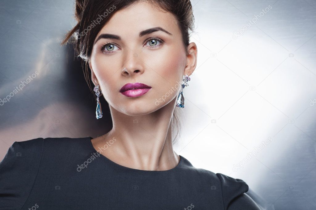 Beautiful fashion model posing in exclusive jewelry. Profession
