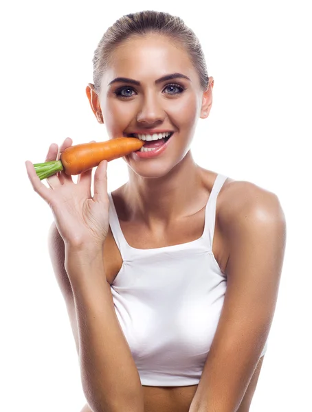 Girl with carrots — Stock Photo, Image