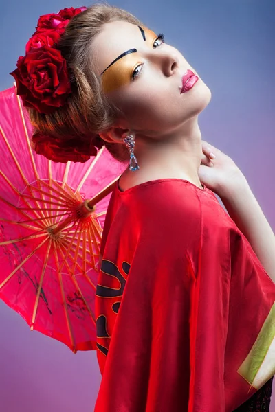 Fashion asian woman wearing traditional japanese red kimono wit — Stock Photo, Image