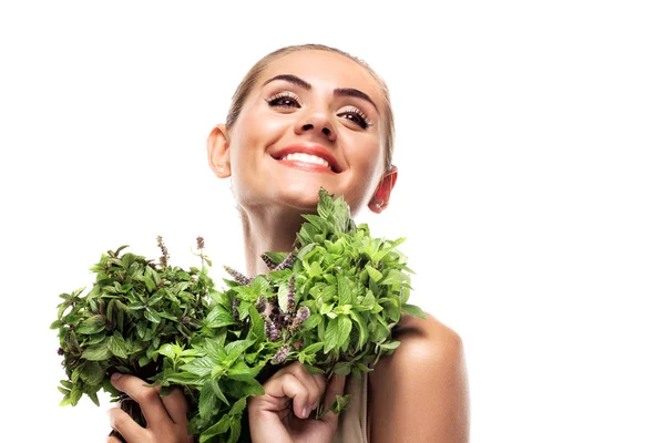 Woman with a bundle of fresh mint. Concept vegetarian dieting - — Stock Photo, Image