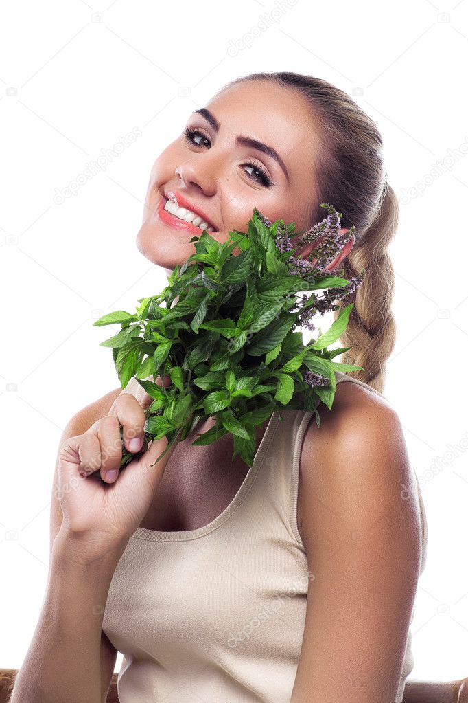 Woman with a bundle of fresh mint. Concept vegetarian dieting