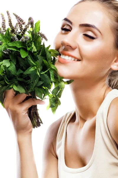 Portrait of happy young woman with a bundle of fresh mint — Stock Photo, Image