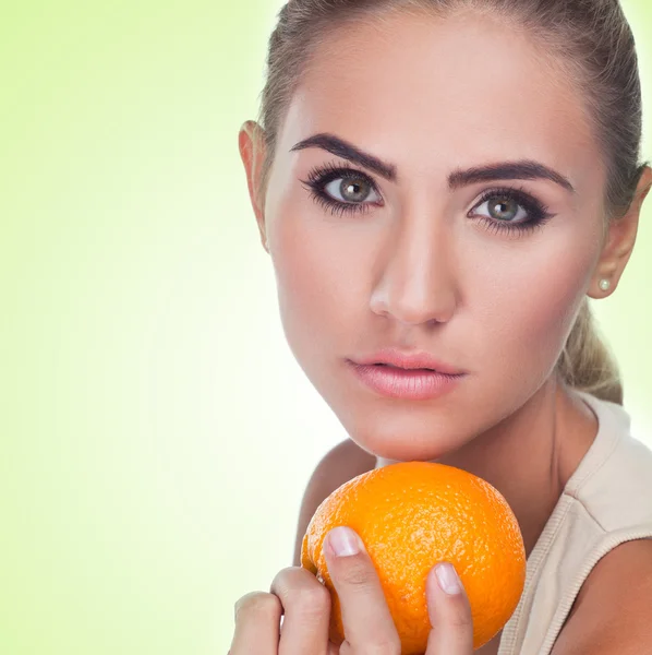 Close-up portrait of happy young woman with juice on white backg — Stock Photo, Image