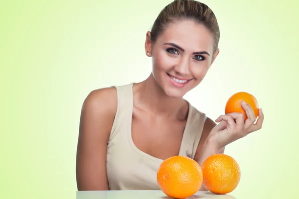 Close-up portrait of happy young woman with juice on white backg — Stock Photo, Image