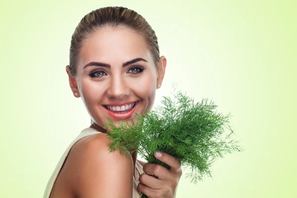 Close-up portrait of happy young woman with bundle herbs (dill) — Stock Photo, Image