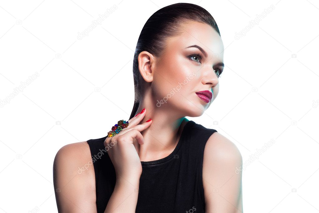 Portrait of beautiful fashion model posing in exclusive jewelry.