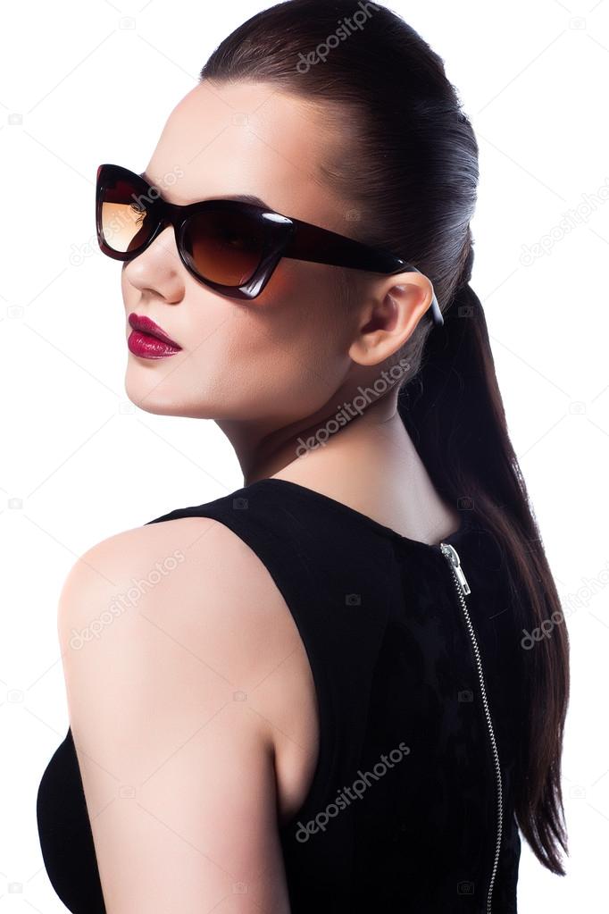 Portrait of beautiful and fashion girl in sunglasses, studio shot