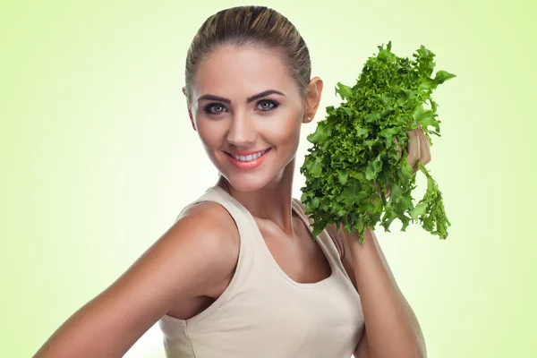 Mujer con manojo de hierbas (ensalada). Concepto de dieta vegetariana —  Fotos de Stock