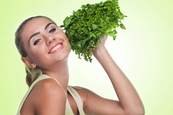 Woman with bundle herbs (salad). Concept vegetarian dieting Stock Image