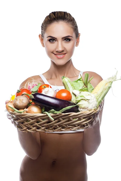 Woman holding basket with vegetable — Stock Photo, Image