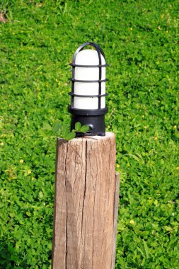 close-up garden lamp on the background of green grass clipart