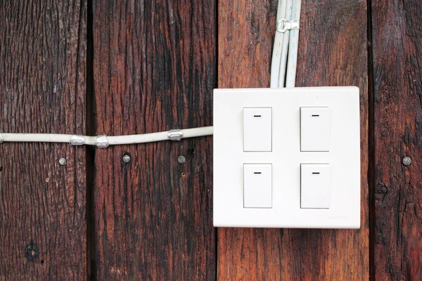 Buzzer switch on wooden wall — Stock Photo, Image