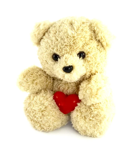 Teddy urso brinquedo com coração no fundo branco — Fotografia de Stock