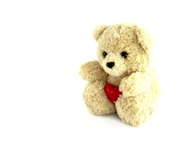 Jouet ours en peluche avec coeur sur fond blanc — Photo