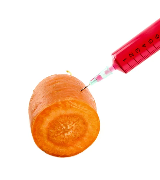 Carrot with syringe injected isolated on white background — Stock Photo, Image