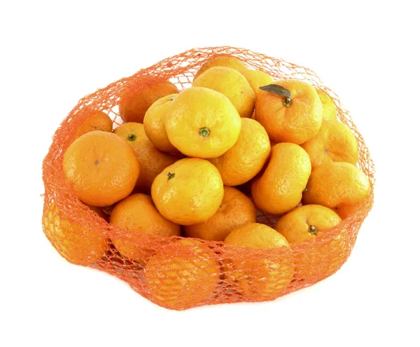 A bunch of oranges packaged in netting, isolated on white — Stock Photo, Image