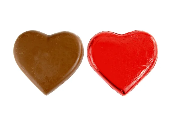 Chocolates, forma de corazón, aislado sobre fondo blanco —  Fotos de Stock