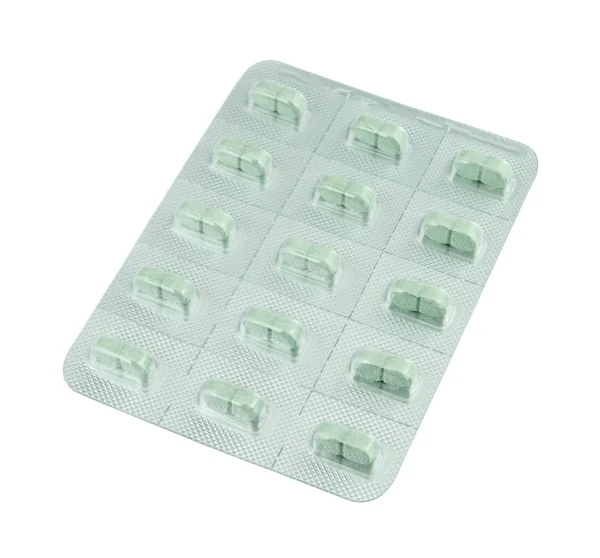 Paquete de pastillas verdes en blanco — Foto de Stock