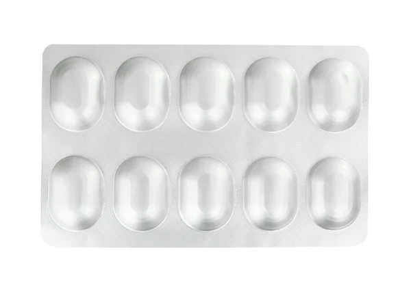 Pastillas en un blister sobre un blanco — Foto de Stock