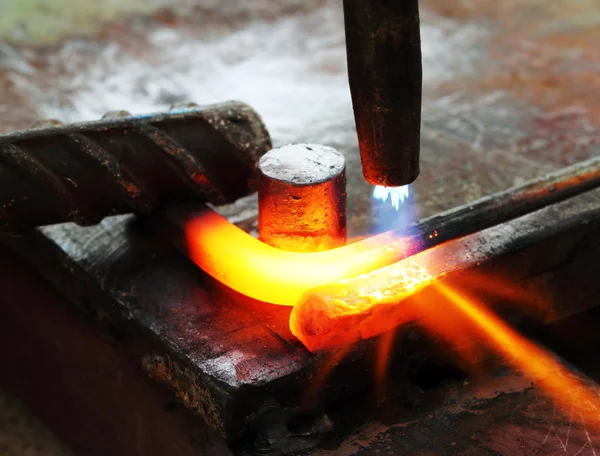 Gas heating cutting metal bending square bar — Stock Photo, Image