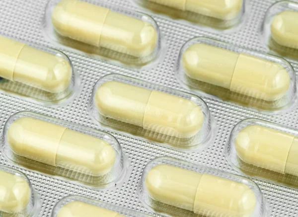 Confezione di pillole gialle — Foto Stock