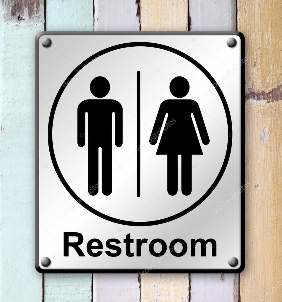 restroom sign on old colour wooden wall