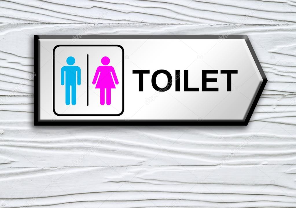 toilet sign on white wooden wall