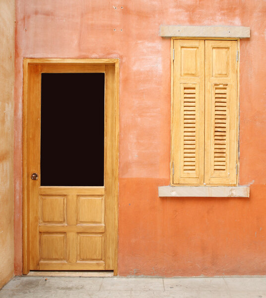 The vintage door and window on wall background