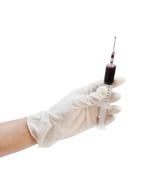 Syringe with blood in hand on white — Stock Photo, Image