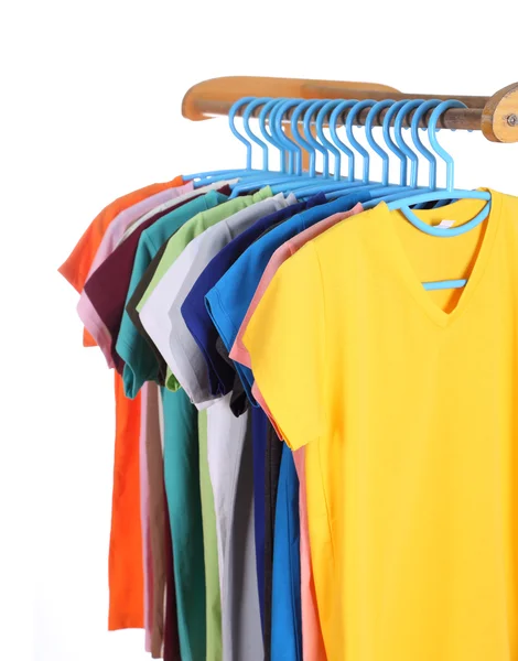 T-shirts hanging on hangers — Stock Photo, Image